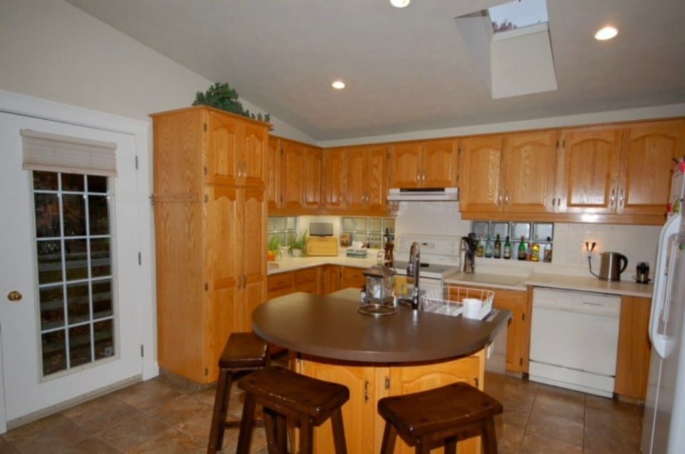 Kitchen with island and bar stools