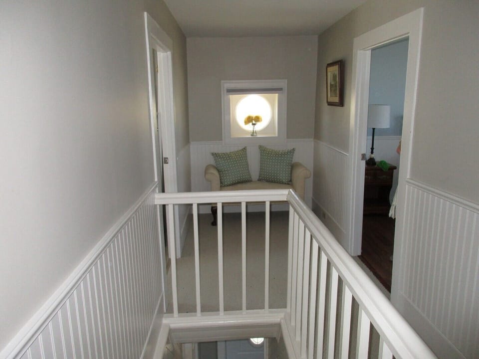 Picturesque window at the end of the hall lets you enjoy the outdoor scenes.