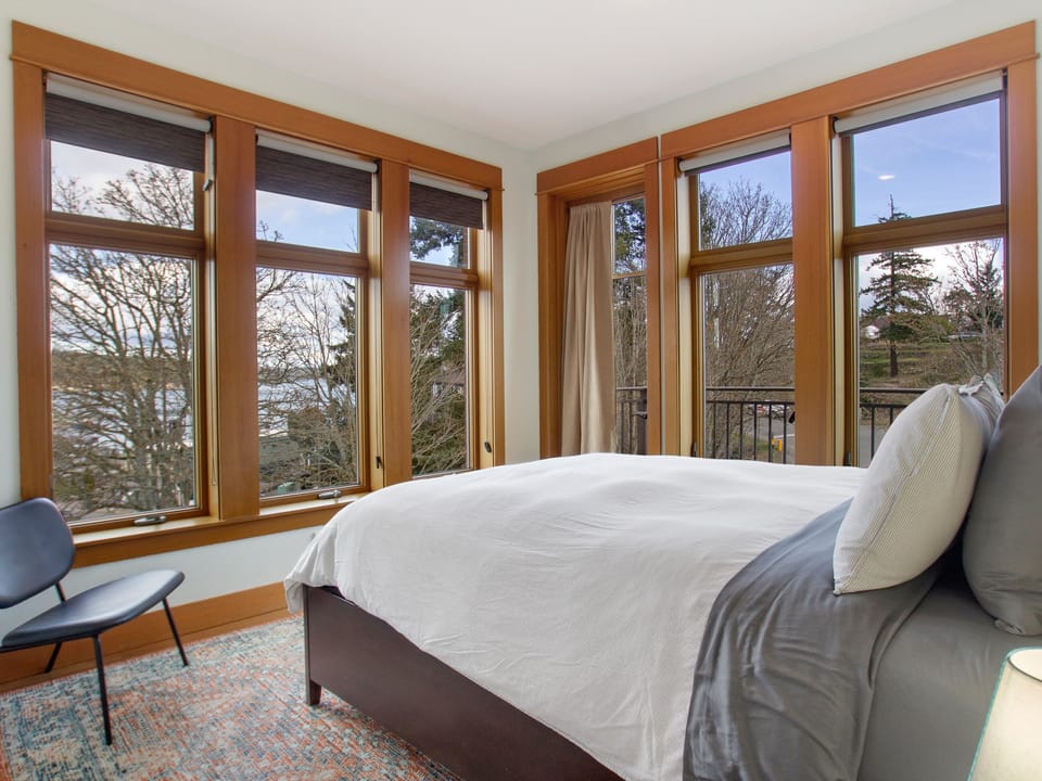 Bedroom #1: Queen bed with filtered water view and view of ferry landing.
