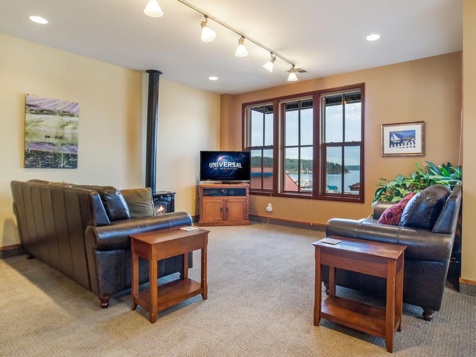 The living room boasts two couches, a propane fireplace and Satellite TV.