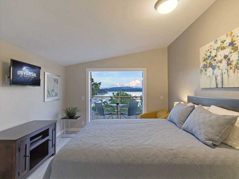 Queen bedroom and water view deck.

Adults Only Please