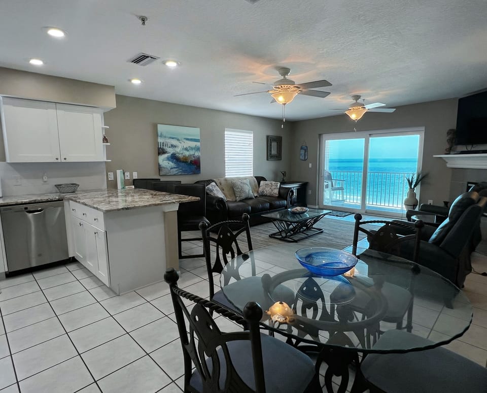 Beachfront dining right off the kitchen and living room. - Beachfront dining right off the kitchen and living room.