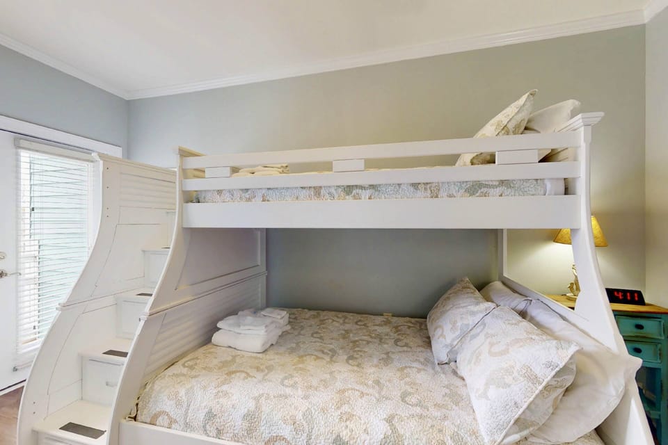 Bunk room with a twin over full bunk bed. Top bed is for kids only
