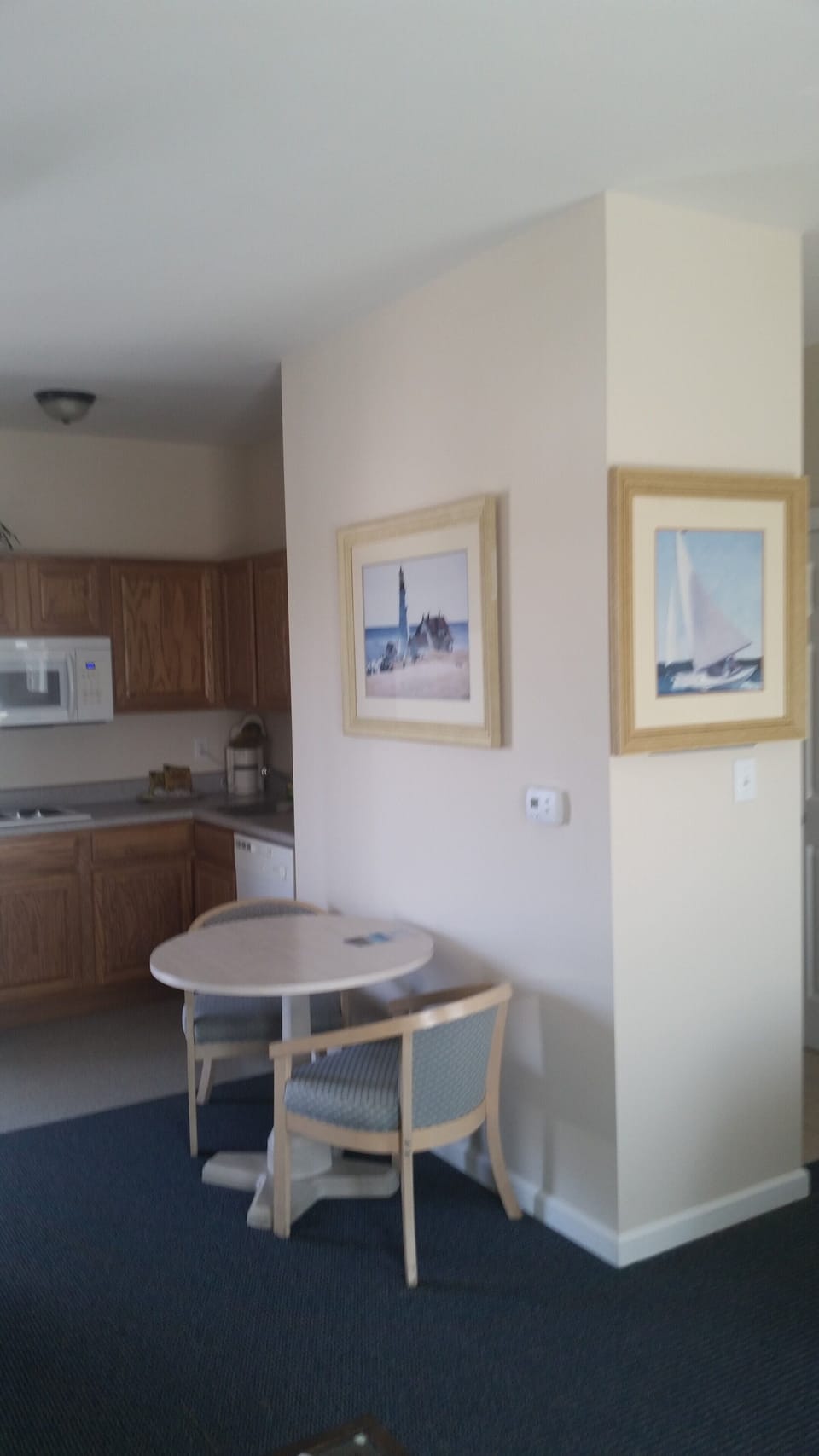 Roomy kitchen with table and 2 chairs