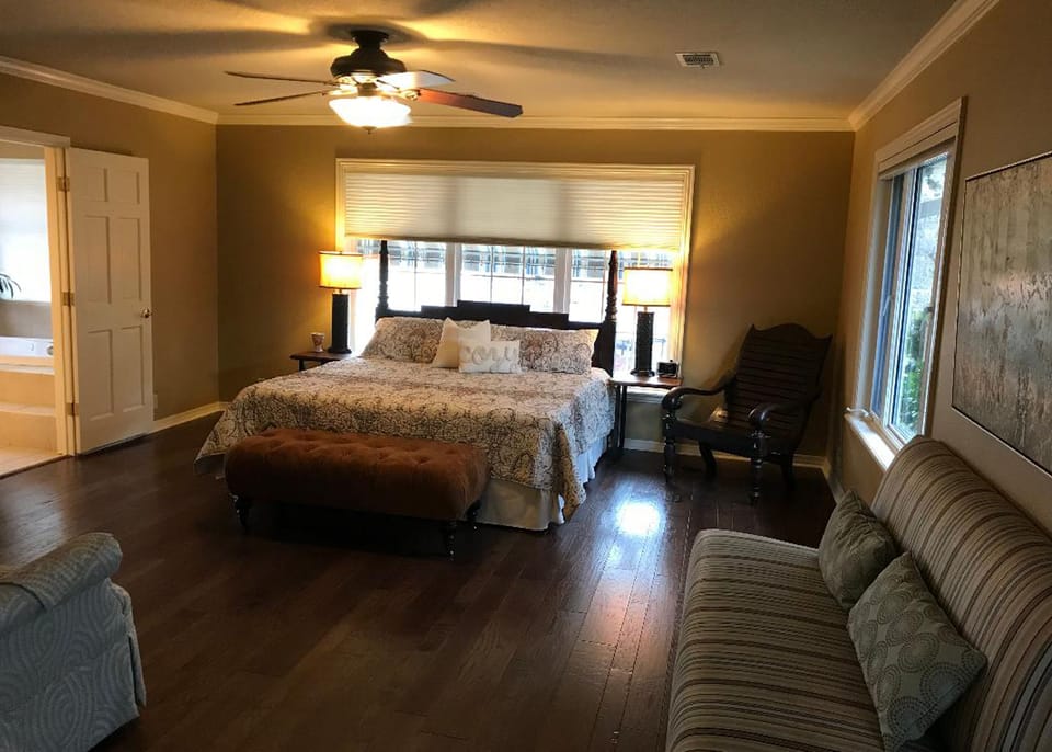 Huge master suite with with lake view and a large flat panel TV. 