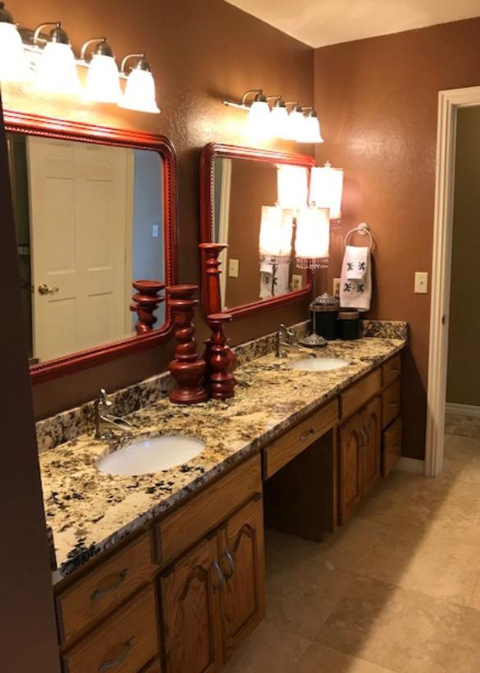 Guest bath with double vanity and shower tub combo. 