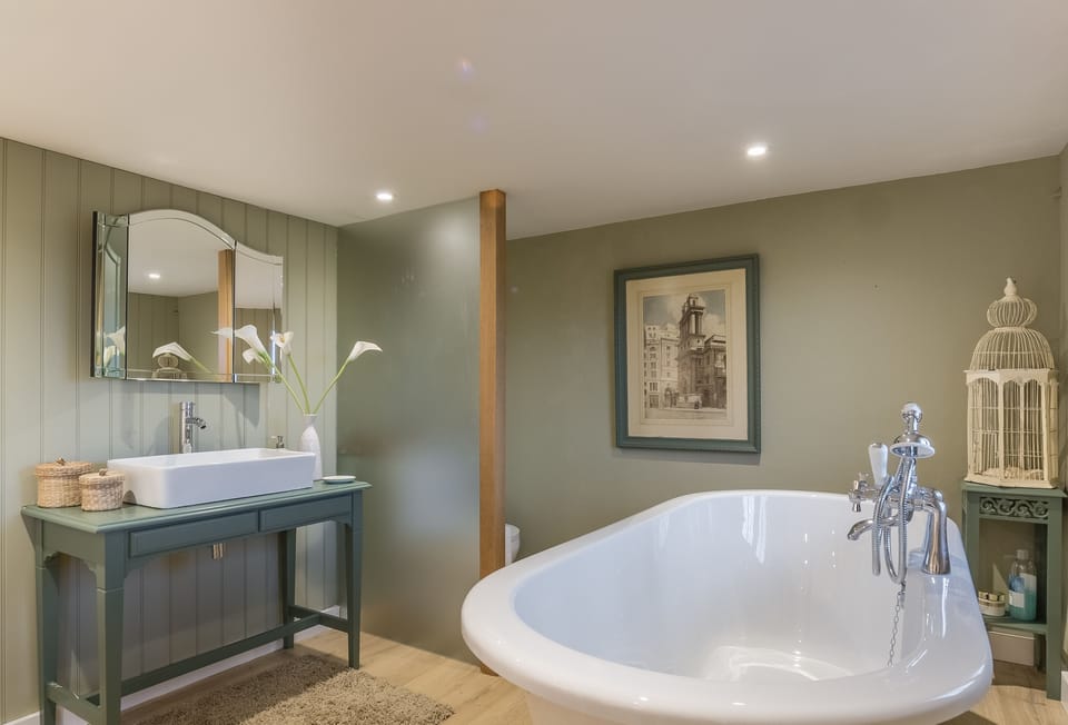 First floor: Bedroom one's integrated en-suite bathroom facilities