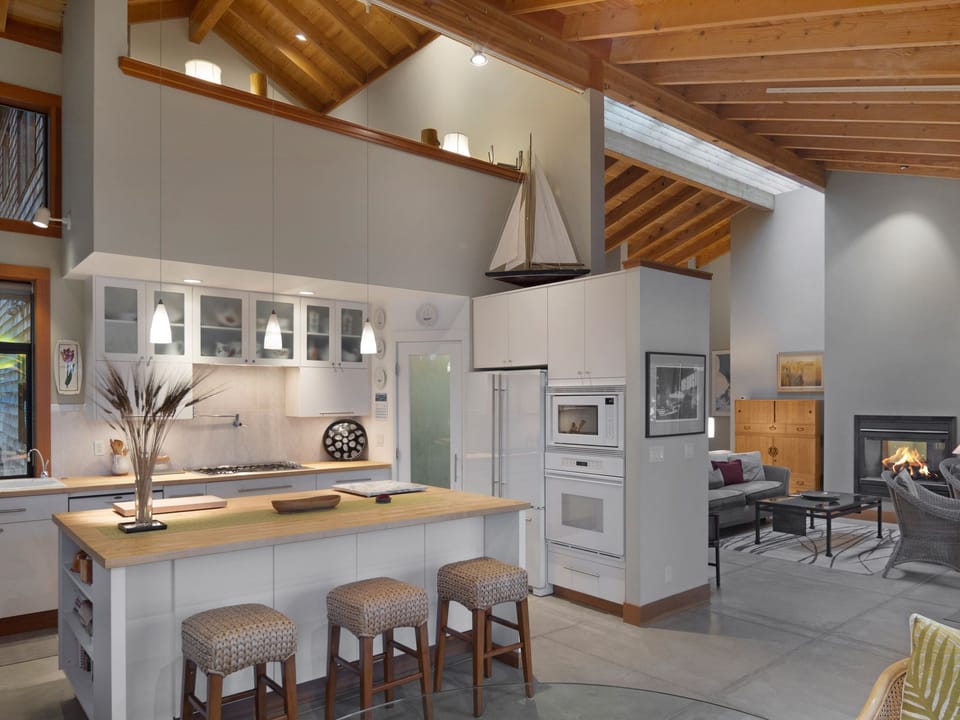 Fully stocked kitchen opens up to living room, dining room and Loft (see above)