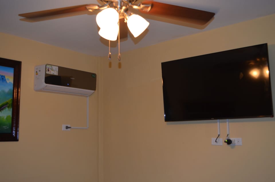 Bedroom with 42' TV and Air Conditioner