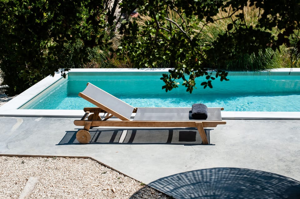 A subbed under the trees facing the pool one of these simple moments at arterra.