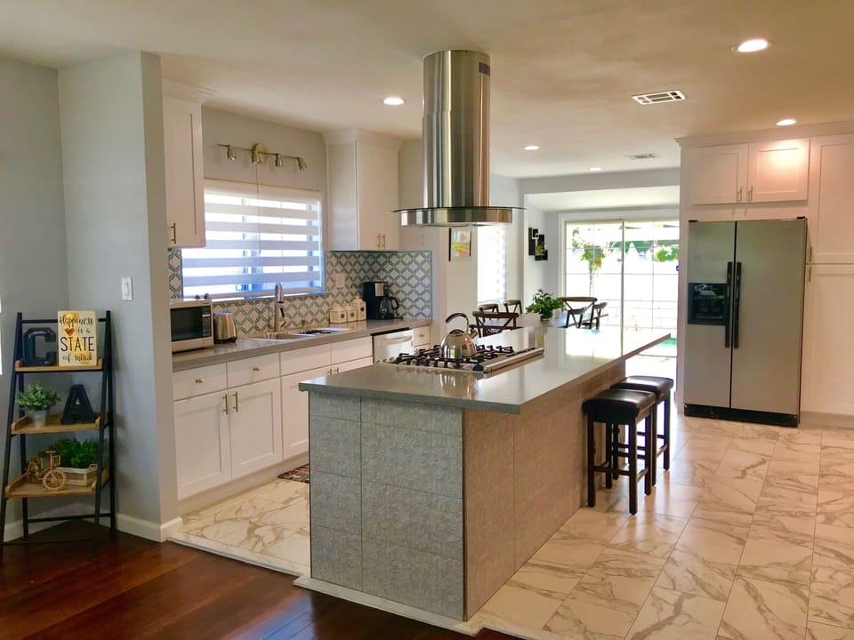 Kitchen and dining area with sliding back door to the backyard