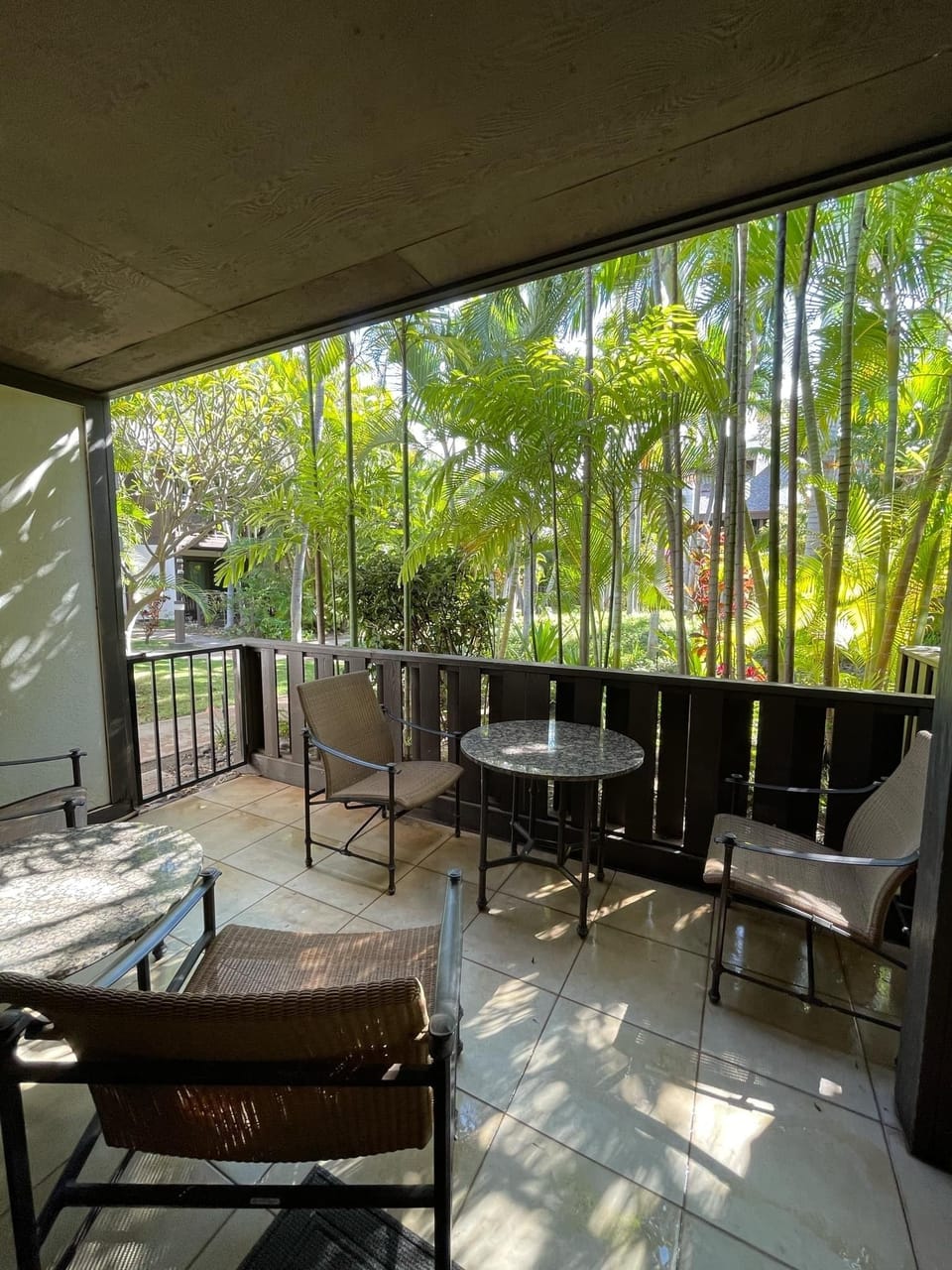 Lanai overlooking lush gardens - relax with coffee or have a romantic dinner