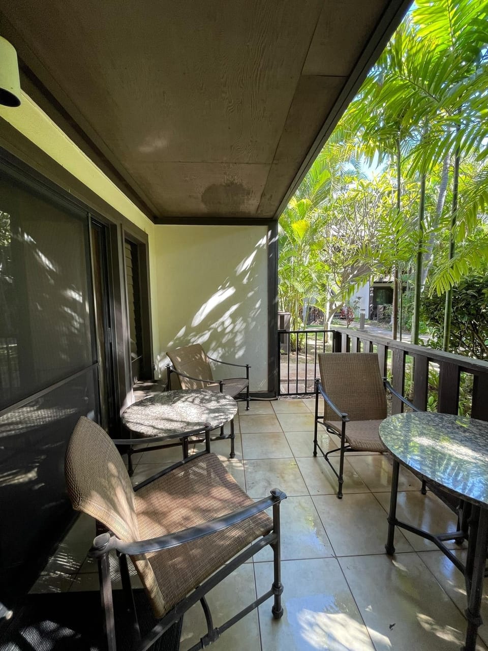 Lanai overlooking lush gardens - relax with coffee or have a romantic dinner