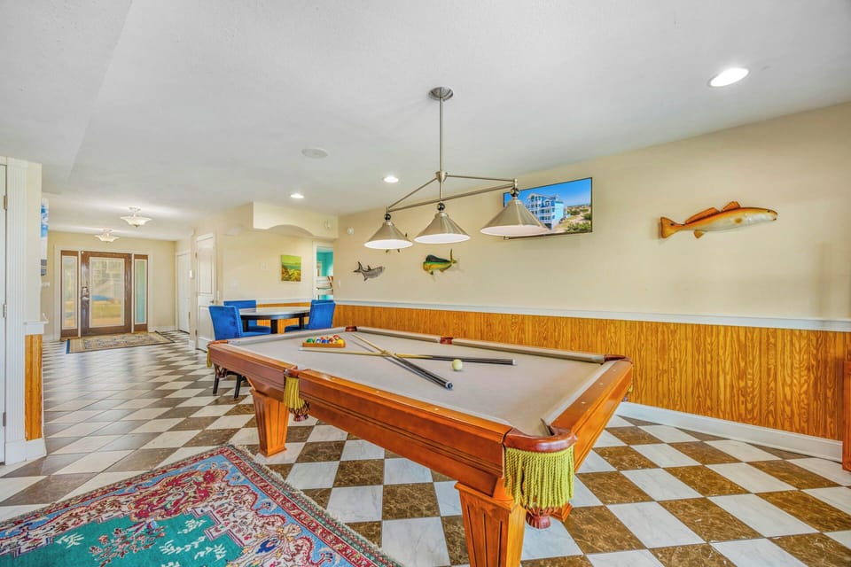 Challenge your travel companions to a friendly billiards match in this fun game room, complete with coastal-themed décor and plenty of space to relax between turns.