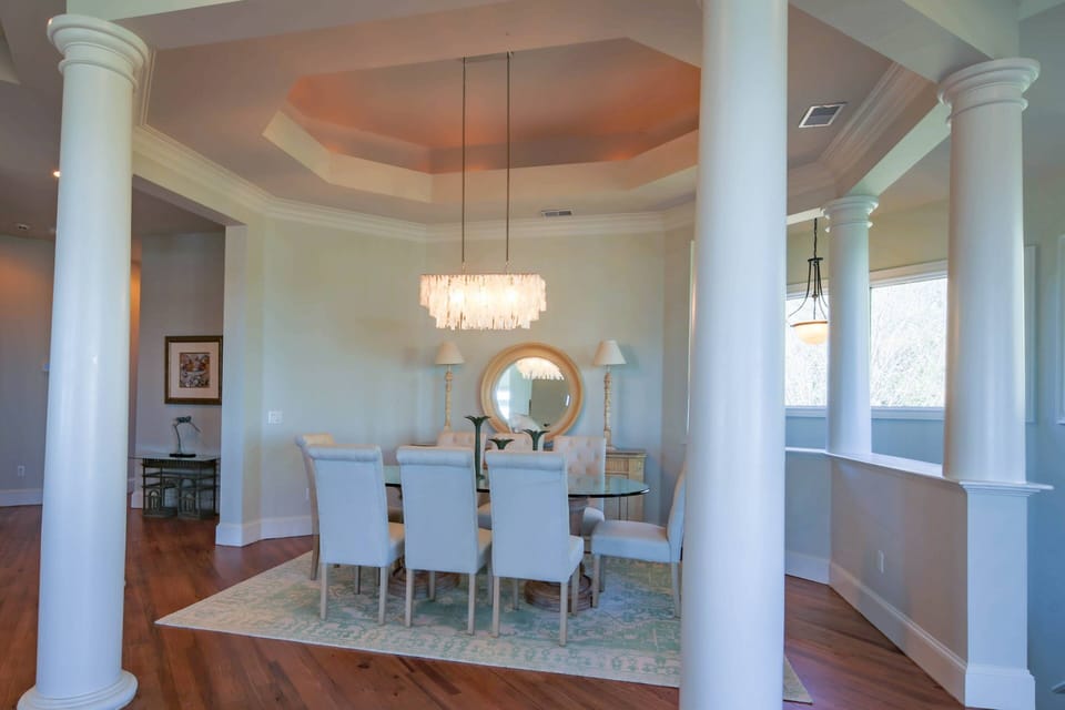 The dining table comfortably seats 8.