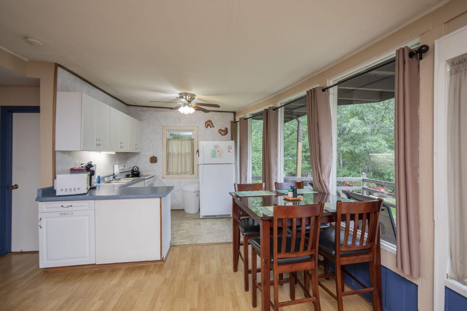 dining area, dining table seats 4 
(TV tray tables are provided as well)