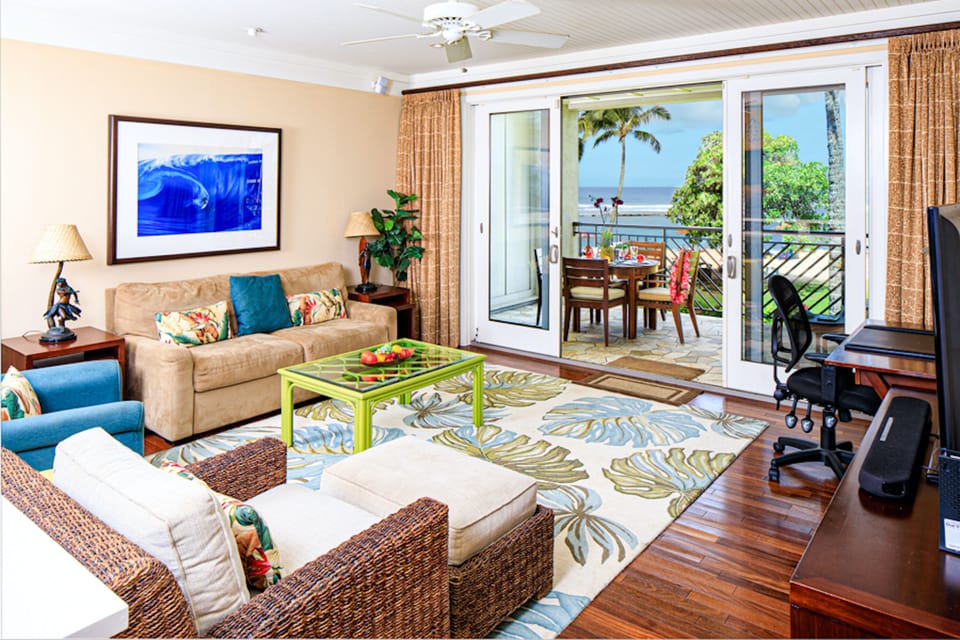 Living room with ocean view in Main Villa! - with pull-out gel memory foam sofa bed and 55" SMART TV and ceiling fan.