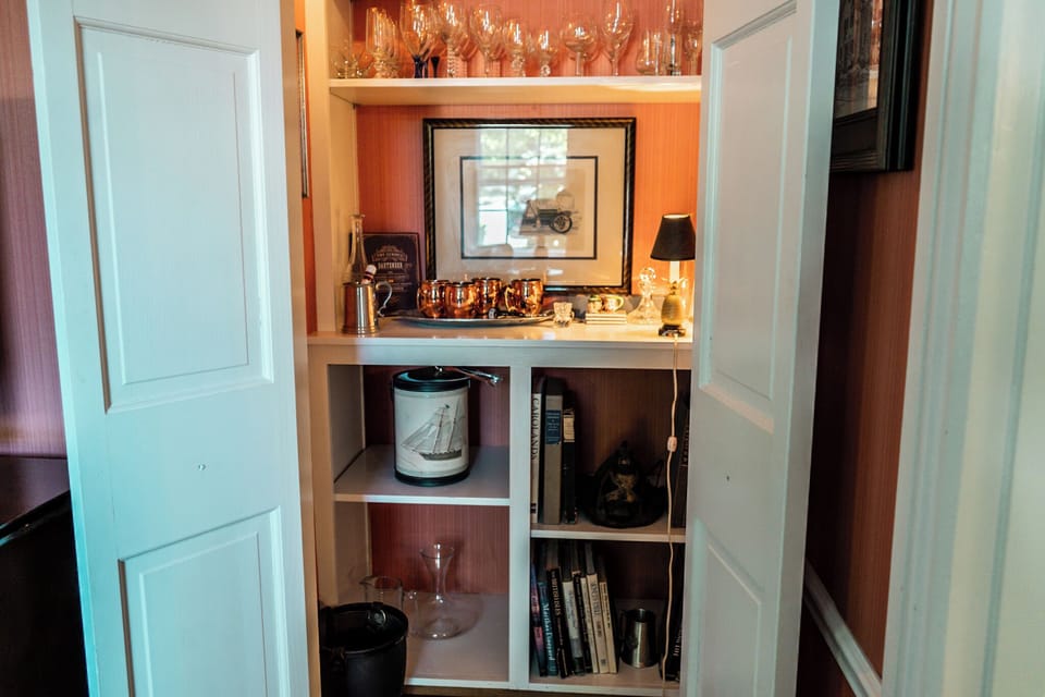 Take a peek at our beautiful bar storage in the den