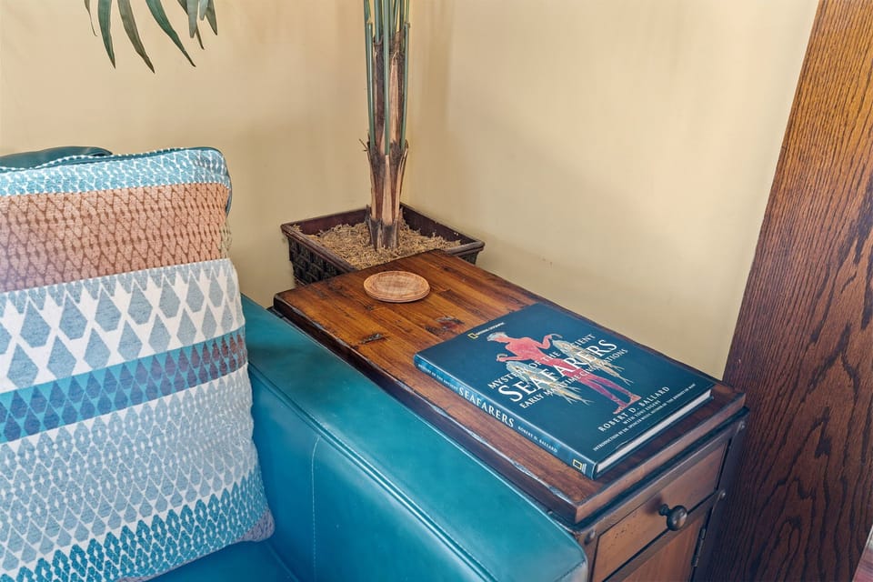 Curl up with a good book in your cozy reading nook, where vintage charm meets modern comfort for perfect afternoon escapes.