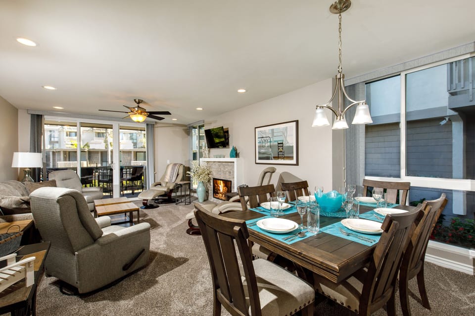 Dining/Living - The spacious dining/living area is warmed by a cozy fireplace.