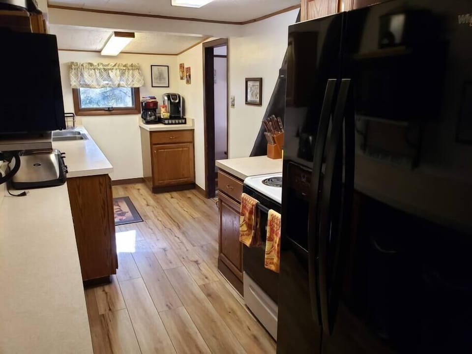 Fridge has door water and ice. Keurig and 12-cup coffee pot. K-cups provided.