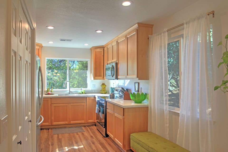 New custom cabinets, sparkly quartz counter tops, and stainless appliances