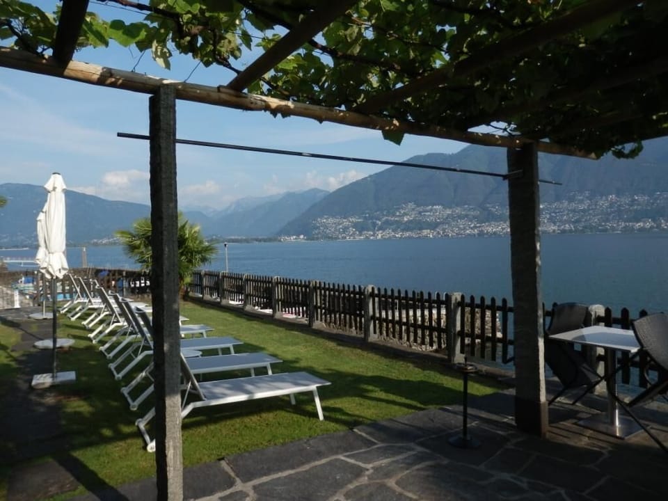 Lawn with pergola and seats