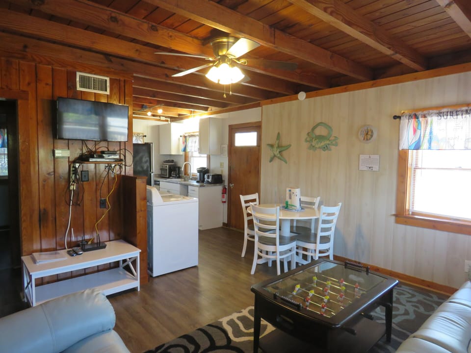 Living room area has a smart tv and cable 