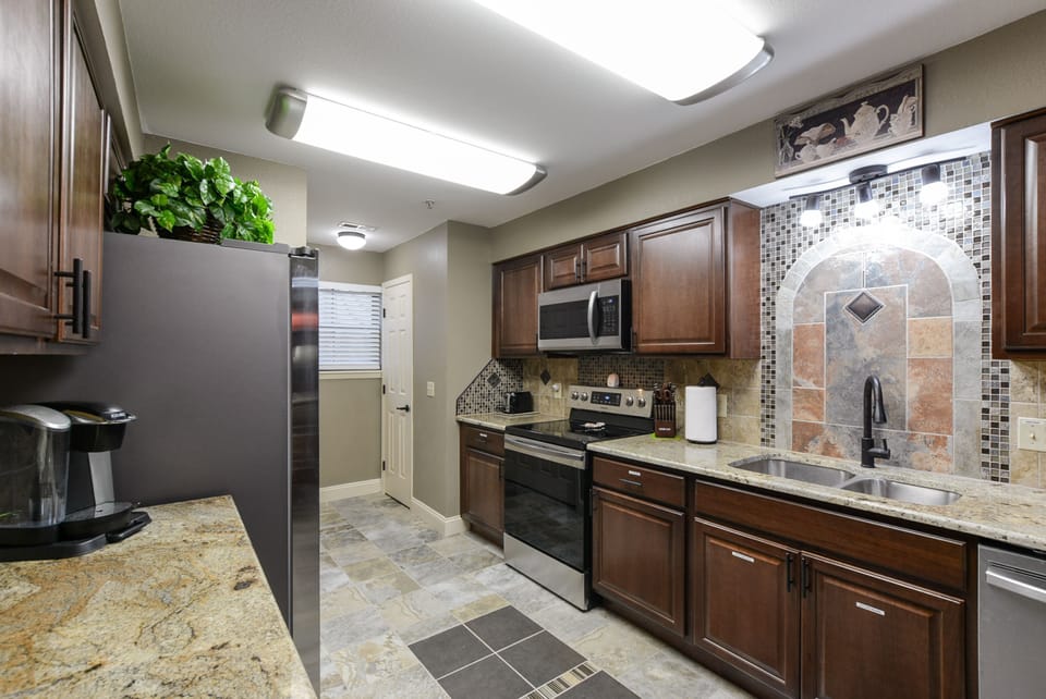 Fully stocked Kitchen, all new stainless appliances, granite counters, and tile