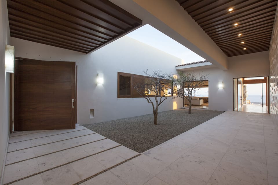 Private interior courtyard looking at Kitchen and Living Room area to the ocean.