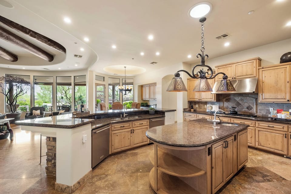 Kitchen - There are 2 dishwashers, a prep sink in the island, walk-in pantry and a bar area in the kitchen.