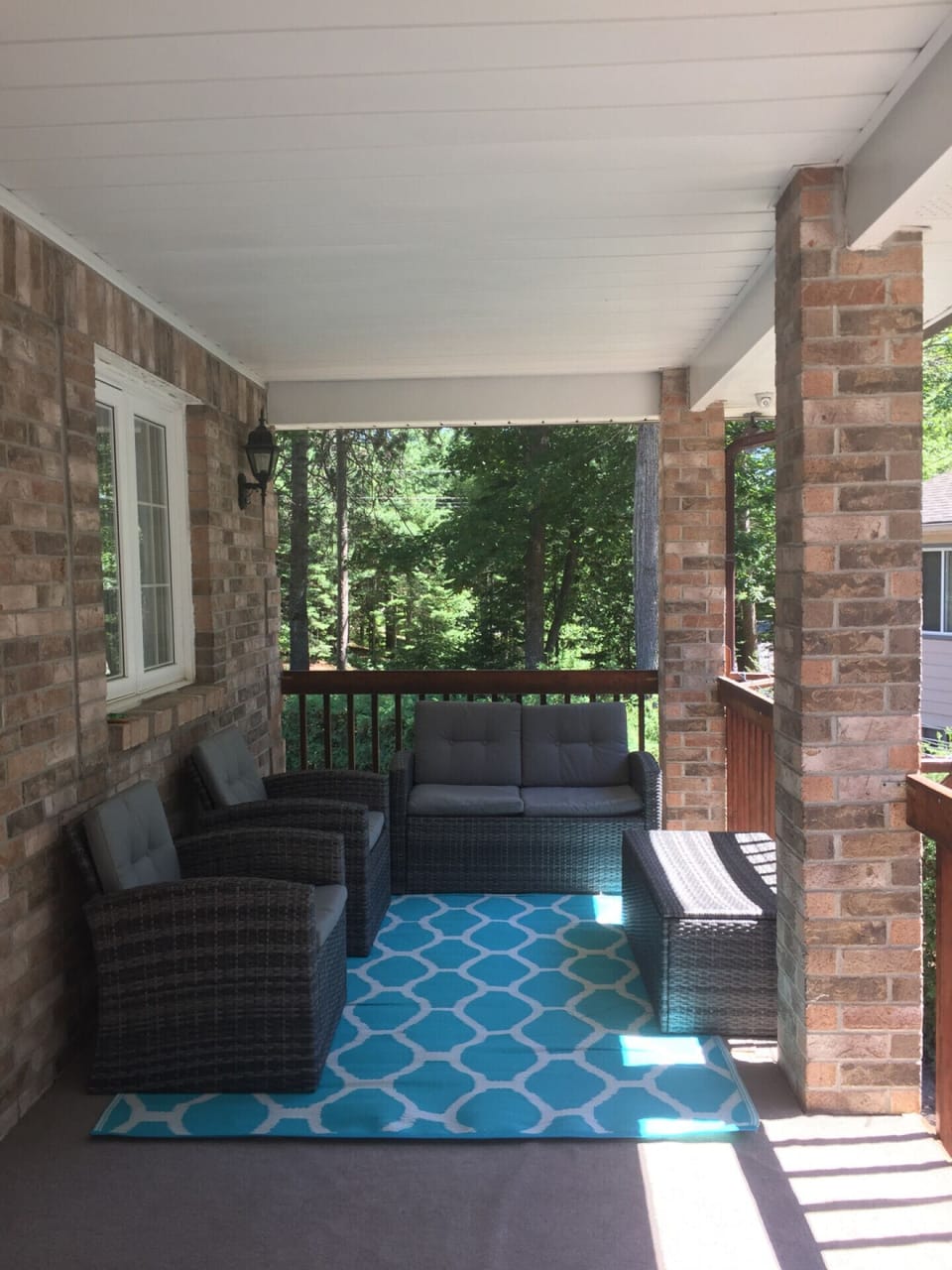 Outside seating area on the covered balcony.
