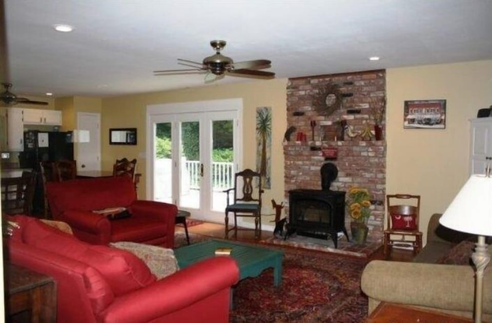 Main Floor - Open concept living/dining area opens to deck through French doors