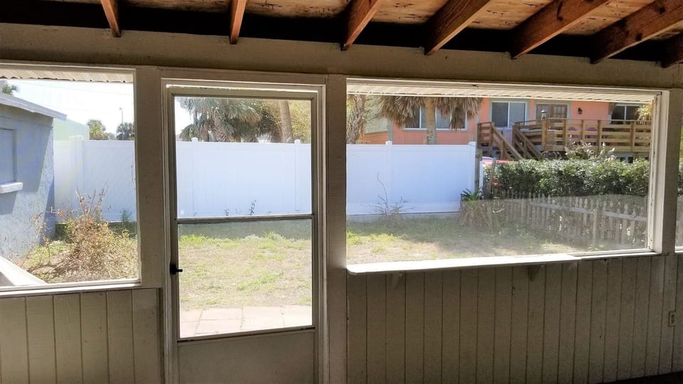  fenced in yard w grill , lounge chairs
point of view from enclosed back porch 