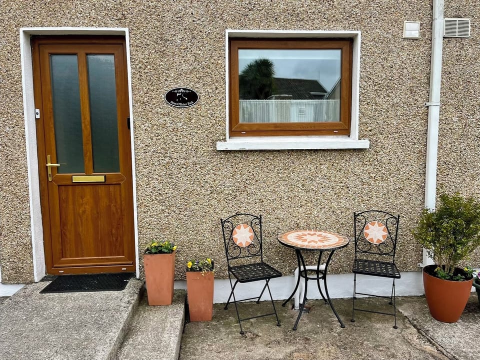 Front door with bistro seating to enjoy your morning coffee