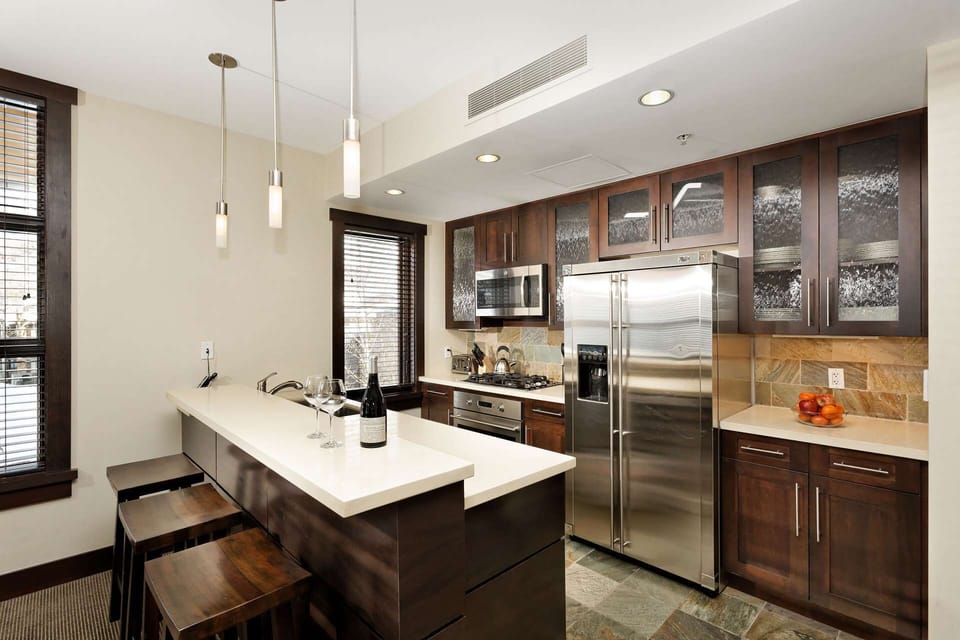 The kitchen is fully stocked with coffee maker, toaster, dishwasher, microwave, oven and refrigerator.  The breakfast bar is a perfect spot for a quic