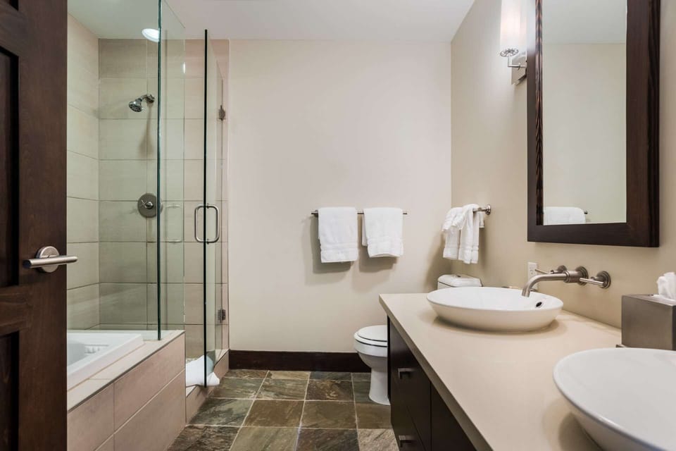 The spacious master bath features a double vanity and separate tub and shower