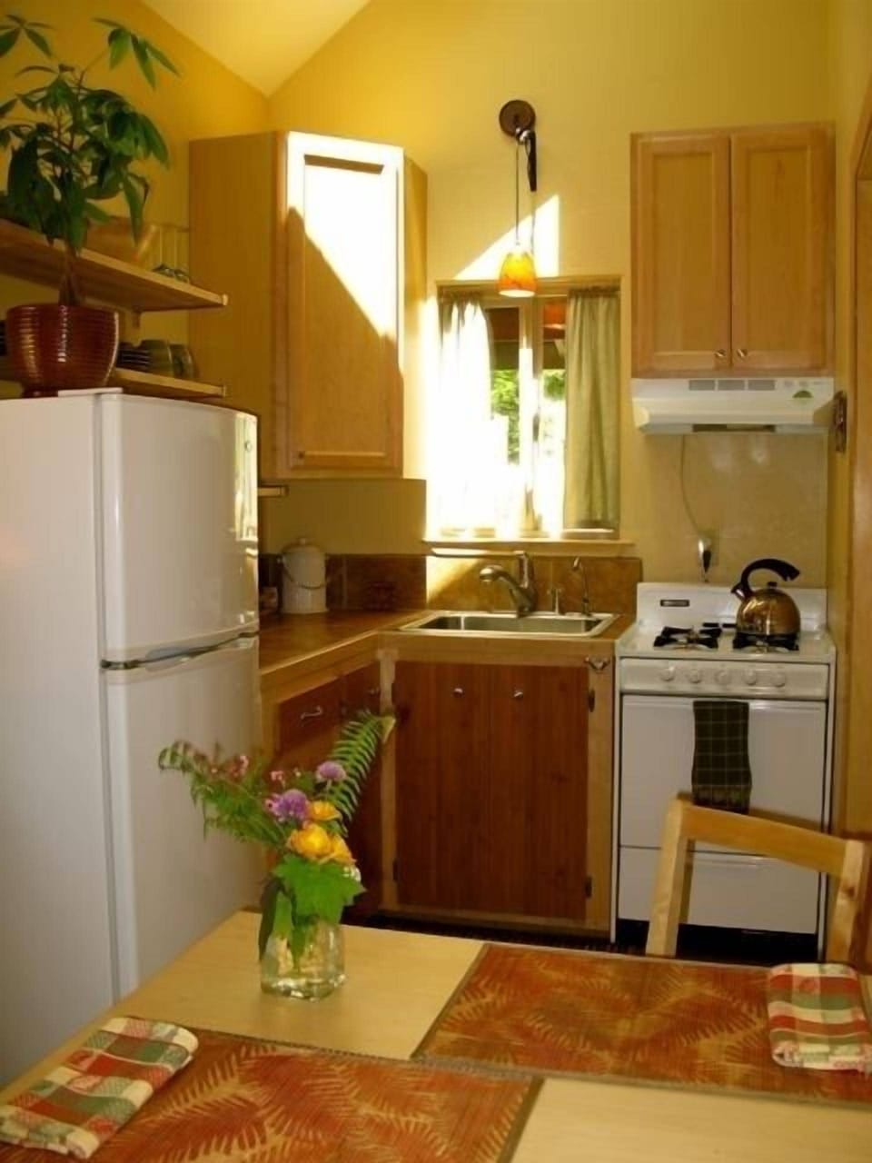 Perfectly sized kitchen leads out to the deck