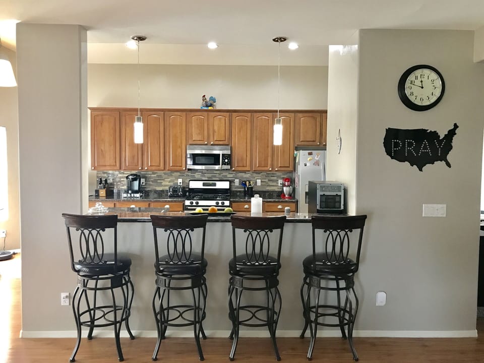 View into the Kitchen from Living Room with Bar 