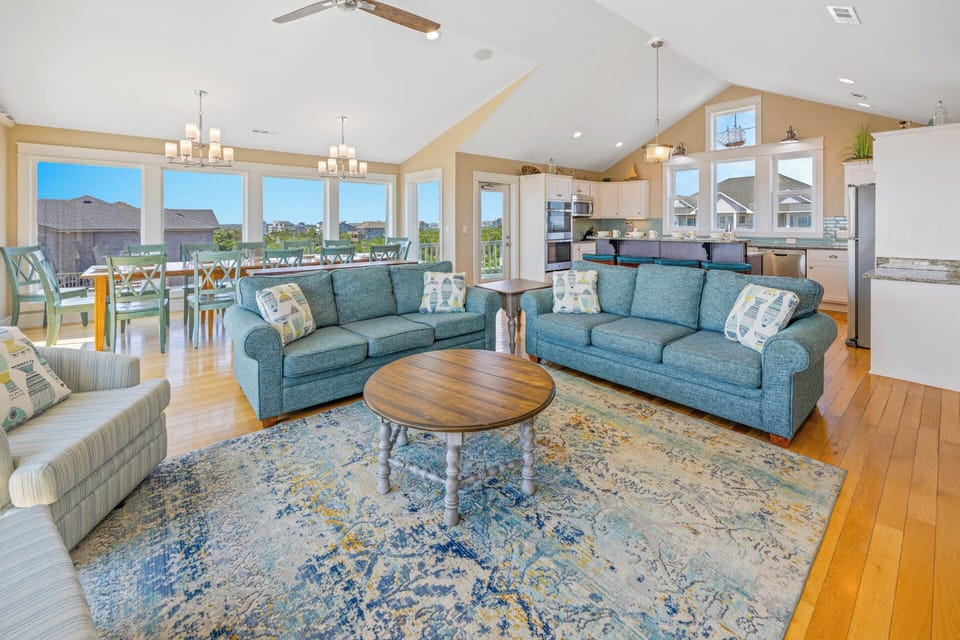 A flowing floor plan seamlessly blends the top level spaces for effortless living and entertaining.