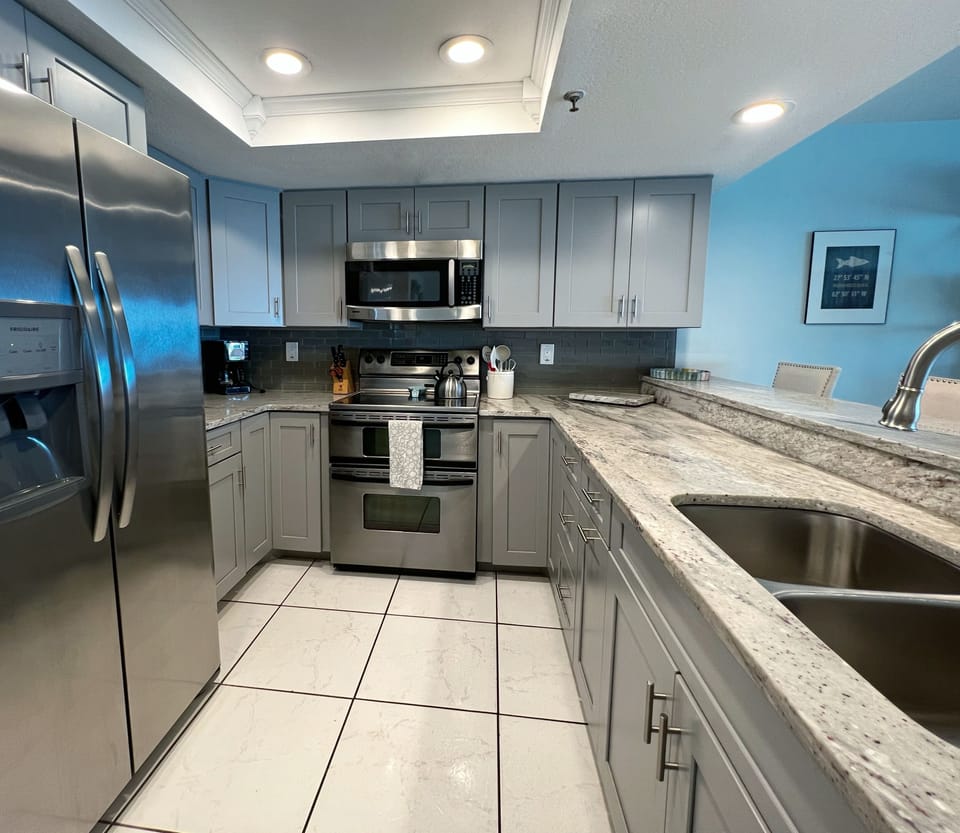 The updated and open concept kitchen is fully equipped and stock - The updated and open concept kitchen is fully equipped and stocked with the necessities you need to cook up your favorite meals and snacks while here!