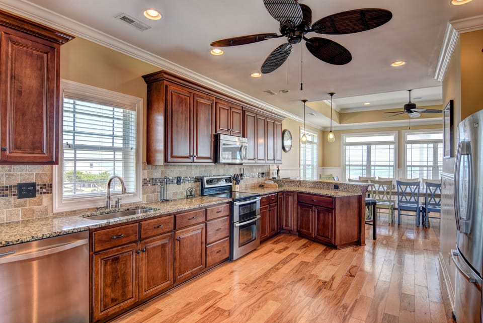 Kitchen breakfast bar, granite, dishwasher, double oven, microwave.
