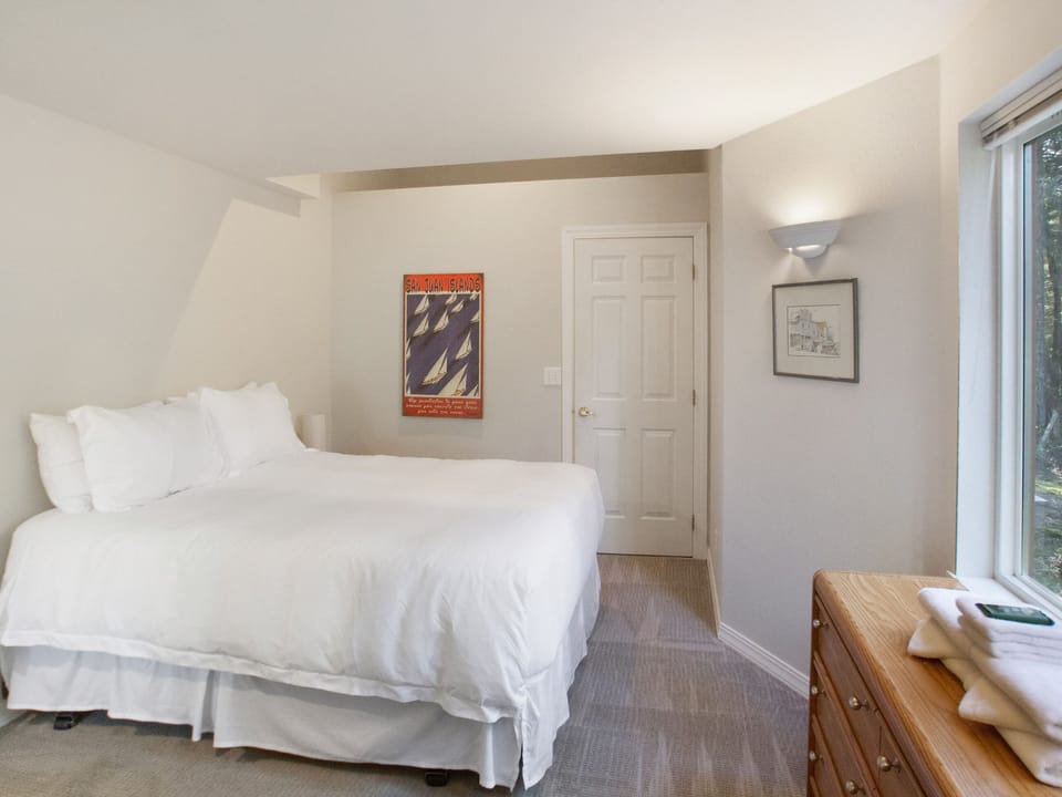 Bedroom #3: Main floor, queen bed with full bathroom across the hall.