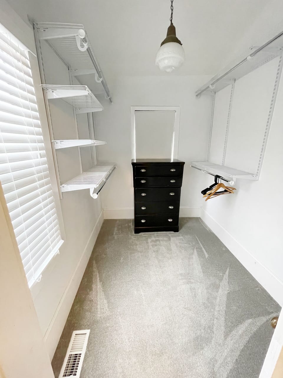Primary bedroom walk-in closet