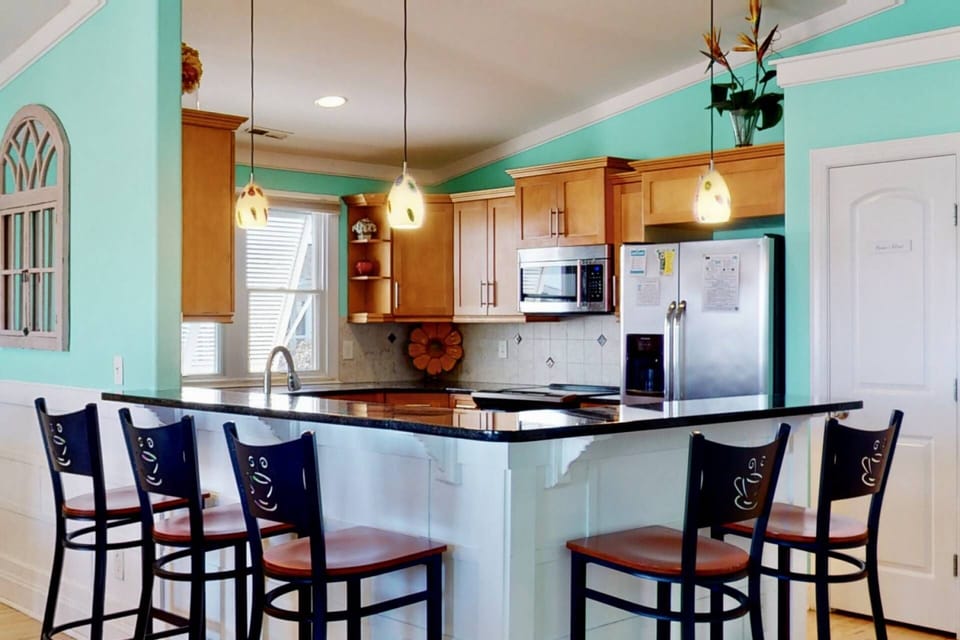 The breakfast bar has seating for a small group of people