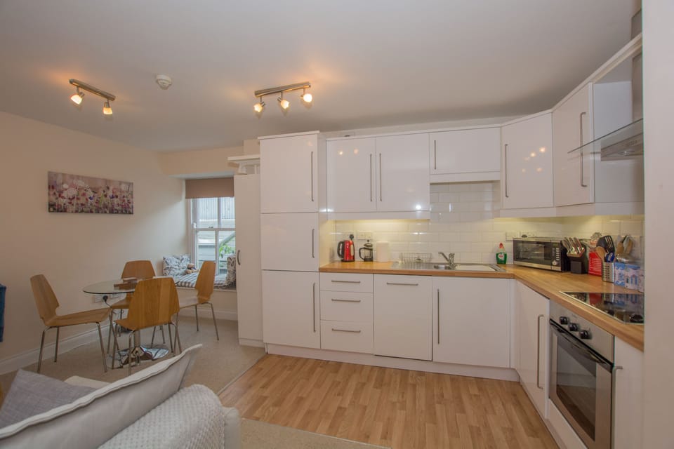 Kitchen with fridge freezer, dishwasher, washing machine, cooker etc.