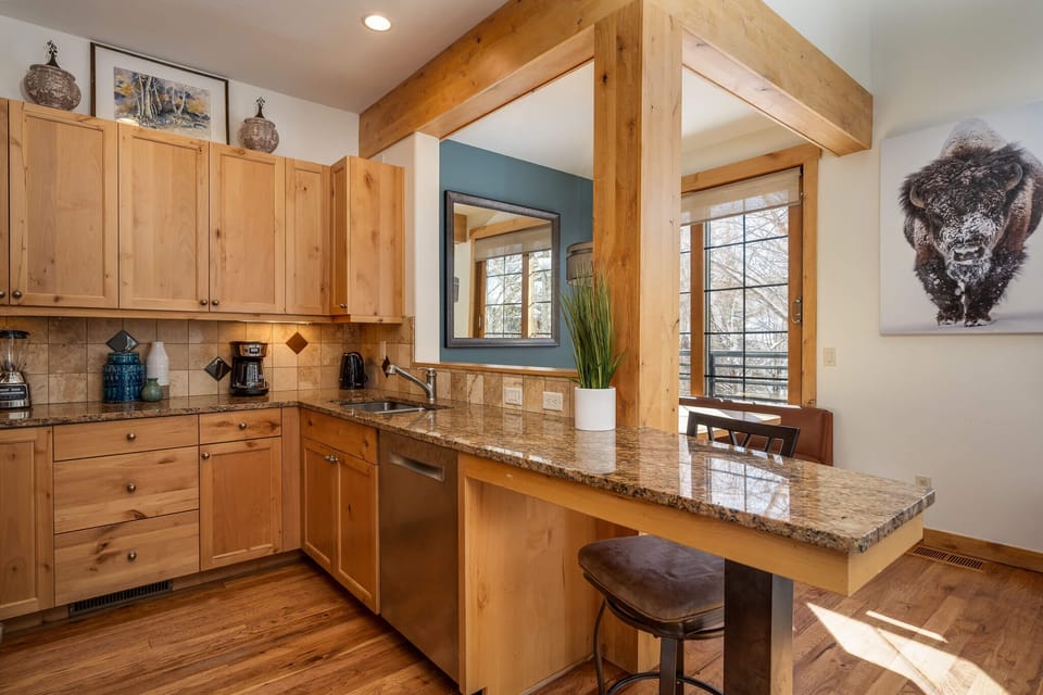 Open kitchen and dining area connected by a serving window
