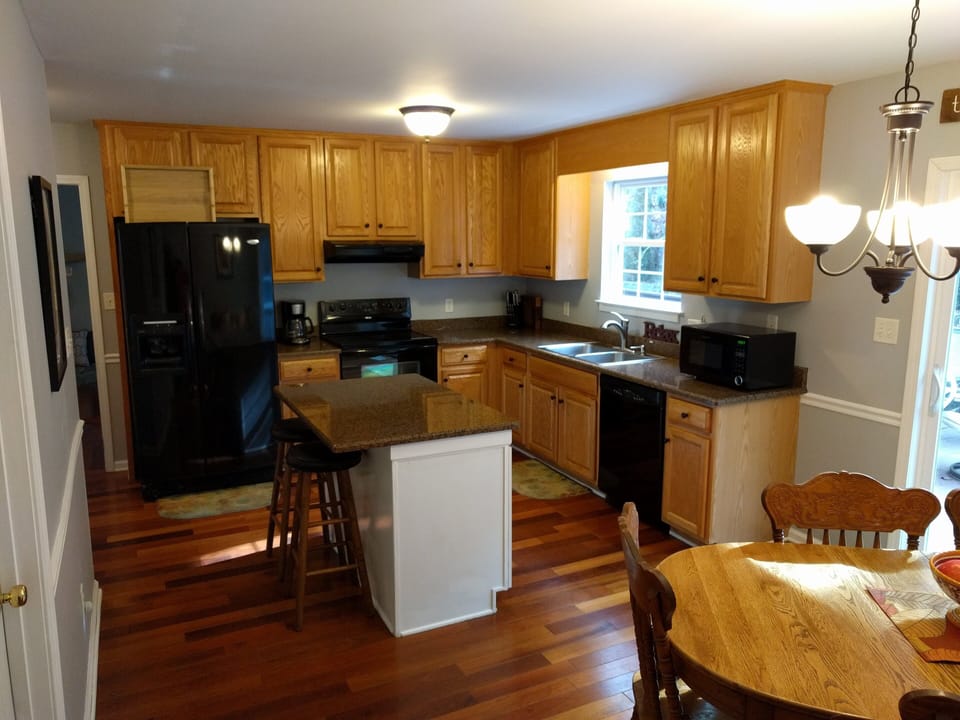 Tons of glasses, dishes, pots, pans, blender, crock pot, griddle and grill