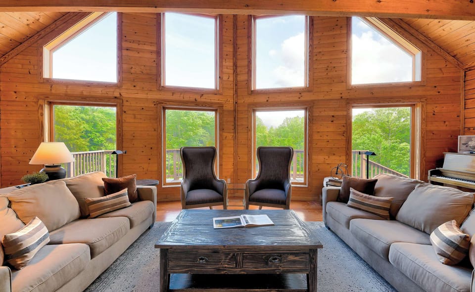 Amazing Gathering Room with Wood Burning Fireplace + Piano