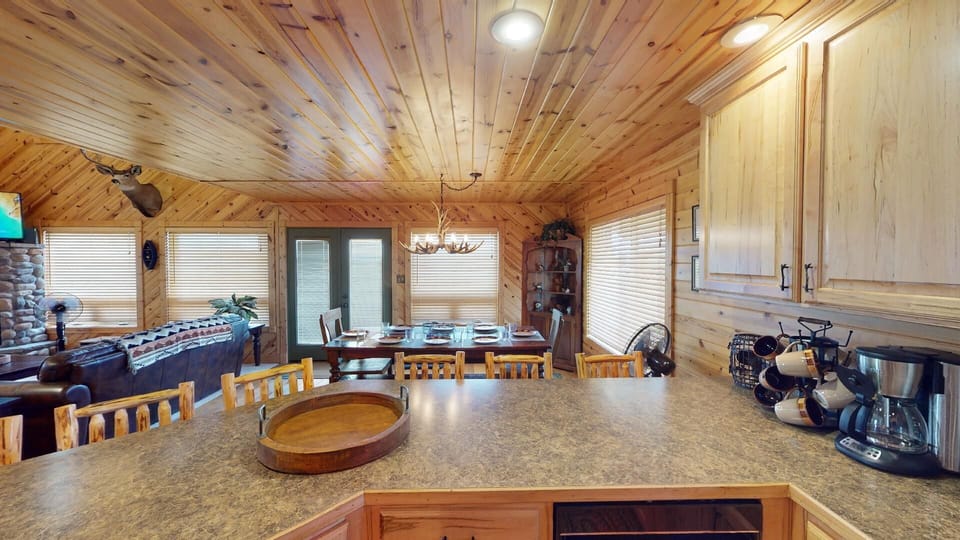 The kitchen island has seating for up to 5 people and the dining room table seats up to 8 people.